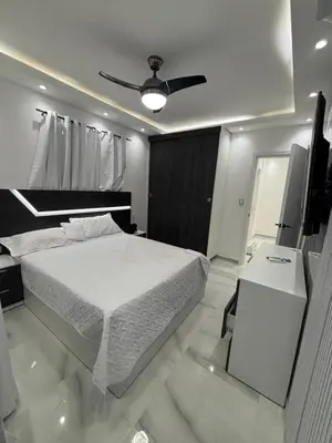 a bedroom with a bed and a ceiling fan at Villa la pal de 4 in La Ureña