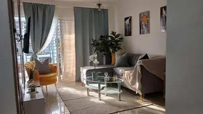 a living room with a couch and a table at Residencial Altos de Alameda in Peralejo