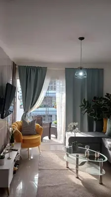 a living room with a couch and a table at Residencial Altos de Alameda in Peralejo
