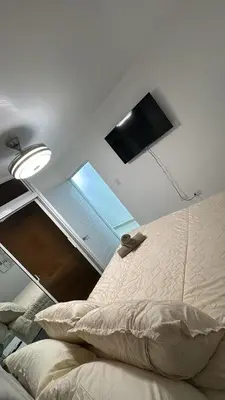 a bedroom with a bed and a window on the ceiling at Spacious 3BR Getaway in Santiago