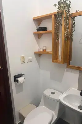 a bathroom with a toilet and a sink at La Española JW in Las Galeras