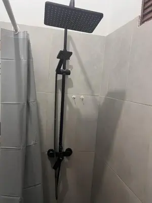 a shower with a solar light in a bathroom at La Española JW in Las Galeras