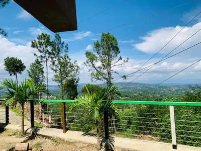 a view from the top of a hill with trees at Villa el privilegio in Jarabacoa