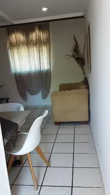 a living room with a table and a couch at Tortuga Cabarete Resindencial in Sosua