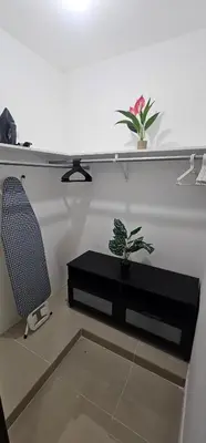 a room with a table and a chair and a plant at Rob's Place in Mendoza