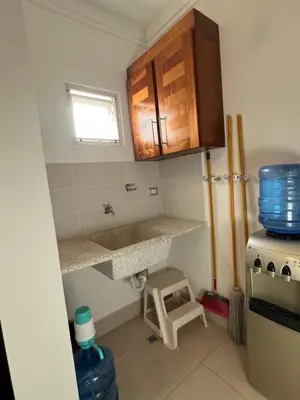 a small kitchen with a sink and a stove at Caribbean luxury in Sosúa