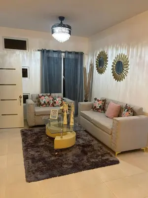 a living room with two couches and a coffee table at Byk 2 in Nagua