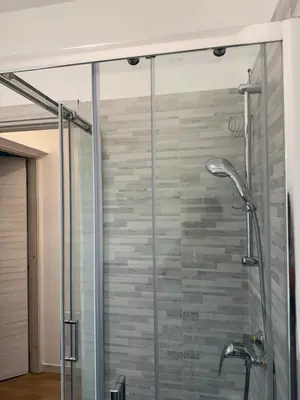 a shower with a glass door in a bathroom at Paradiso Italia Miches in Miches