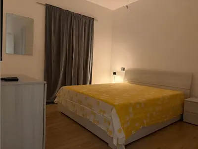 a bedroom with a bed with a yellow blanket at Paradiso Italia Miches in Miches