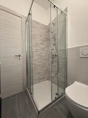 a shower stall in a bathroom with a toilet at Paradiso Italia Miches in Miches