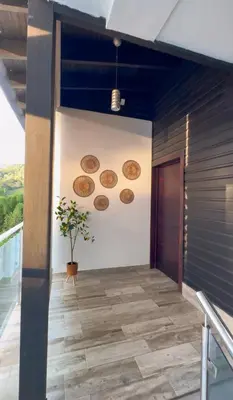 a hallway with several plates on the wall at Villa Ana in Santiago de los Caballeros
