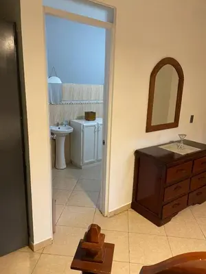 a bathroom with a sink and a mirror at Apartamento en el Corazón de Las Terrenas in Las Terrenas