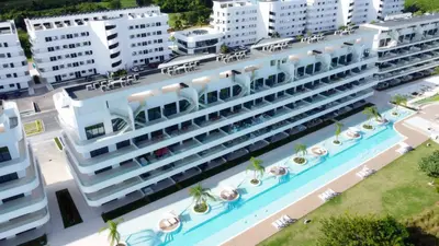 an overhead view of a hotel with a swimming pool at 1BRM Infinity Homes Punta Cana in Punta Cana