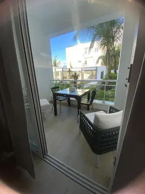 a view of a balcony with a table and chairs at Apartamento Vacacional Coral Azul - SBH in Bayahibe
