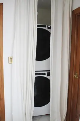 a closet with two black and white toaster ovens at Casaè Rojas Presents Golden Oasis in Punta Cana