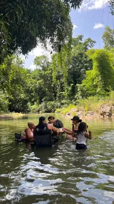 a group of people in the water on a river at Casa de Campo Vive in Ensanche Savica de Mendoza