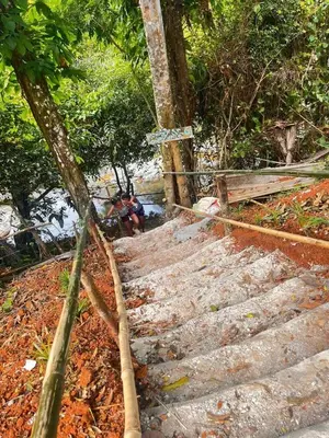 a group of stairs with trees and people sitting on them at Casa de Campo Vive in Ensanche Savica de Mendoza