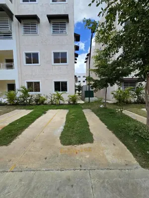 an empty parking lot in front of a building at Los manglares in La Cana
