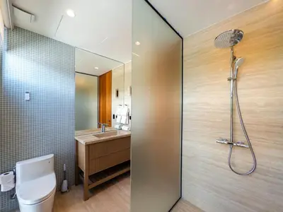 a bathroom with a shower and a toilet and a sink at Luxury Guesthouse Villa with Golf Cart - Casa de Campo in La Romana