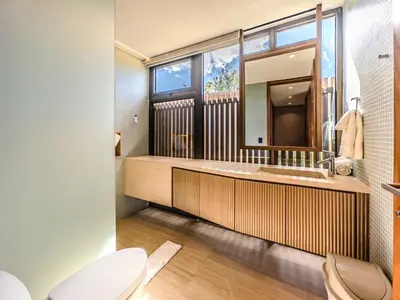 a bathroom with a sink and a mirror at Luxury Guesthouse Villa with Golf Cart - Casa de Campo in La Romana