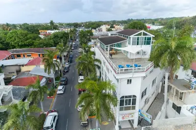 an aerial view of a city street with palm trees at Plaza Achim 6A, Modern APT 250m from Sosua beach! in Sosúa