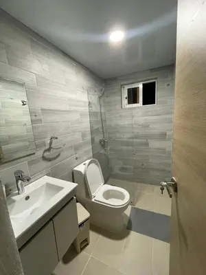 a bathroom with a toilet and a sink at 3 bedroom apartment in Armonía Las Terrenas in Las Terrenas