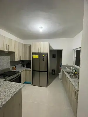 a kitchen with a stainless steel refrigerator in it at 3 bedroom apartment in Armonía Las Terrenas in Las Terrenas