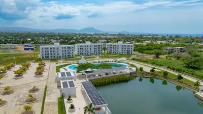 an aerial view of a resort with a pool and buildings at Work & Relax Studio Pools & Fast Wi-Fi in SOV in Sosúa