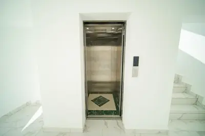 an elevator in a building with a box on the floor at Work & Relax Studio Pools & Fast Wi-Fi in SOV in Sosúa