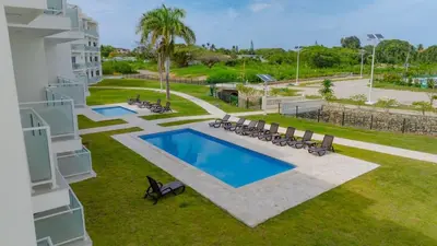 an overhead view of a swimming pool in the yard of a building at Work & Relax Studio Pools & Fast Wi-Fi in SOV in Sosúa