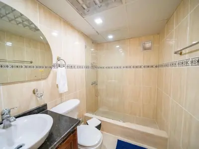 a bathroom with a sink and a toilet and a tub at Charming 1BR Apt with Pool Walk to Sosua Beach in Sosúa