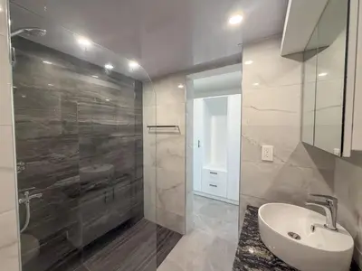 a bathroom with a sink and a shower at Stylish Sosua 2 BR apartment near everything in Sosúa