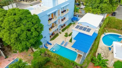 an overhead view of a blue building with a pool at Casa de Compai Studio 1 AC WiFi Prime Location in Sosúa