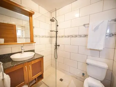 a bathroom with a toilet and a sink and a shower at Casa de Compai Studio 2 Walk to Beach & Fun in Sosúa