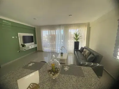 a living room with a couch and a table at 2 Bdrm, 1 Bath, Wifi, Near River and Beach, 2L in Paraíso