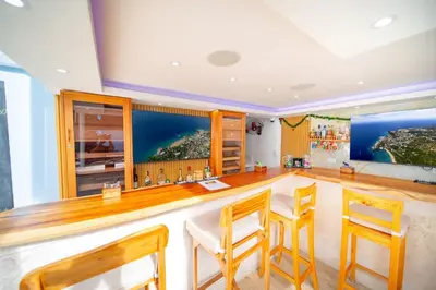 a bar in a room with chairs and tables at Casa de Compai Unit 9 AC WiFi Prime Location in Sosúa