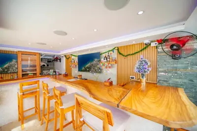a dining room with a large wooden table and chairs at Casa de Compai Unit 9 AC WiFi Prime Location in Sosúa