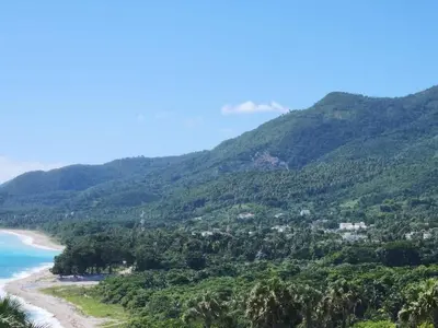 a view of a beach with trees and mountains at 2 Bdrm, 1 Bath, Wifi, Near River and Beach, 2R in Paraíso