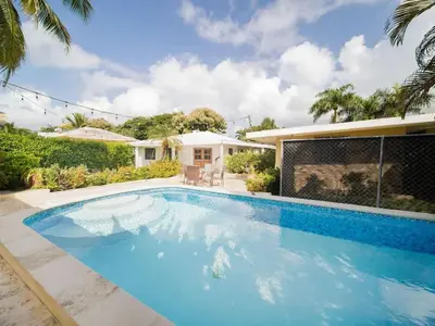 a swimming pool in front of a house at 2 Bedroom Villa with private Pool in Sosua in Sosúa