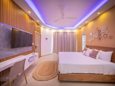 a bedroom with a large bed and a tv at Green Palace 7 Bedroom Villa in Sosua with Security in Sosúa