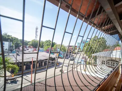 a view of a street through a window at HUGE Balcony APT next to HARD ROCK CAFE and Beach in Sosúa