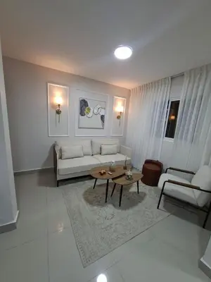 a living room with a couch and a table at Apartment in Santo Domingo in El Caliche