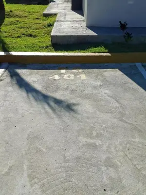 a shadow of a street sign on a sidewalk at Apartment in Santo Domingo in El Caliche