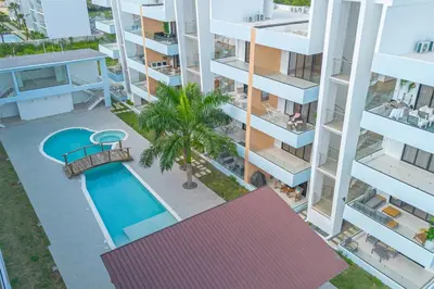 an aerial view of a apartment complex with a swimming pool at Stylish 2BR Apartment in the Heart of Bayahibe in San Rafael del Yuma