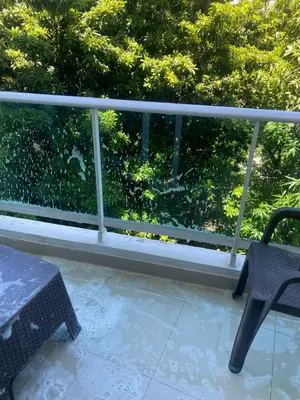 a balcony with a table and a chair at Torre armonía in Punta