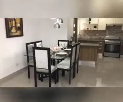 a dining room with a table and chairs in a kitchen at Mediterraneo in Canabacoa