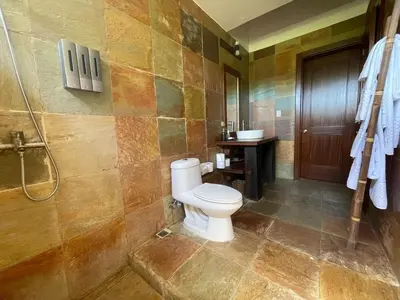 a bathroom with a toilet and a shower at Residence in Juan Dolió, Guavaberry, is ideal in Los Conucos