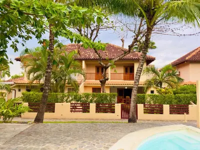 a house with a swimming pool in front of it at Family Villa Terrenas Samana Near the Beach in Las Terrenas