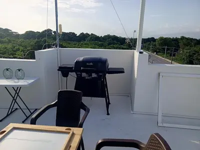 a grill on the deck of a boat at Apartment-View-Beach-Mountains-Rivers-WiFi-AC-CLB in Santa Cruz de Barahona