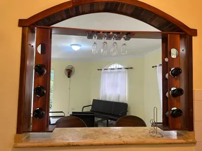 a mirror in a room with a table and chairs at Tu escape natural - No incluye bebidas, tiene costo adicional in Miches